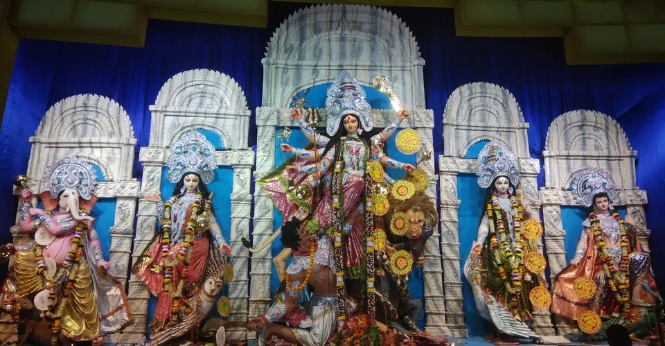 A clay image of Durga with her children in a Kolkata pandal