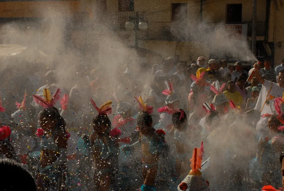 Clouds of talc and confetti over a crowd at the Blacks and Whites’ Carnival in Pasto