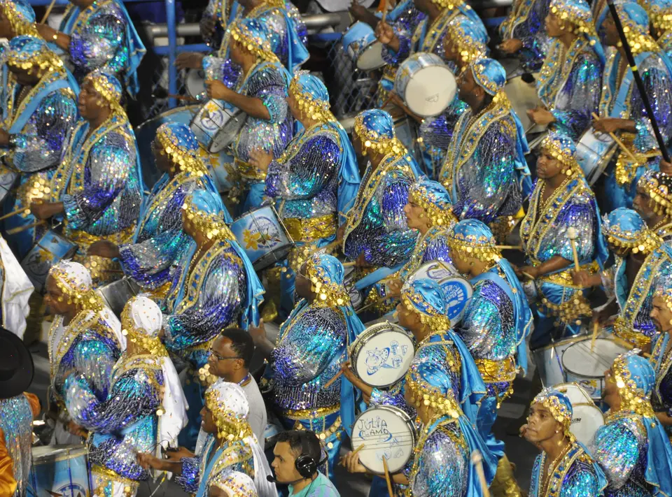 Performers in blue and silver costumes in a samba school parade at the Sambadrome, Rio de Janeiro
