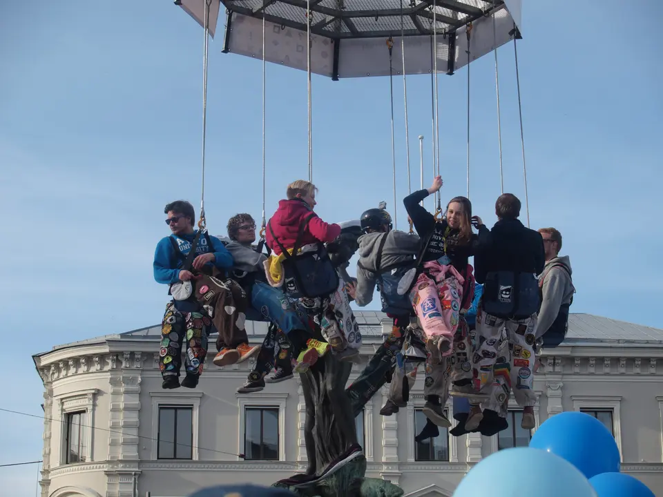 Students lowered by crane for the capping of the Havis Amanda statue on Vappu eve, 2015