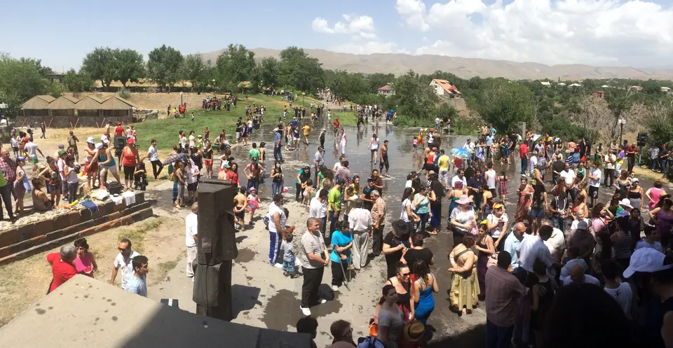 Soaked visitors fill the grounds below the Temple of Garni during Vardavar, 2014